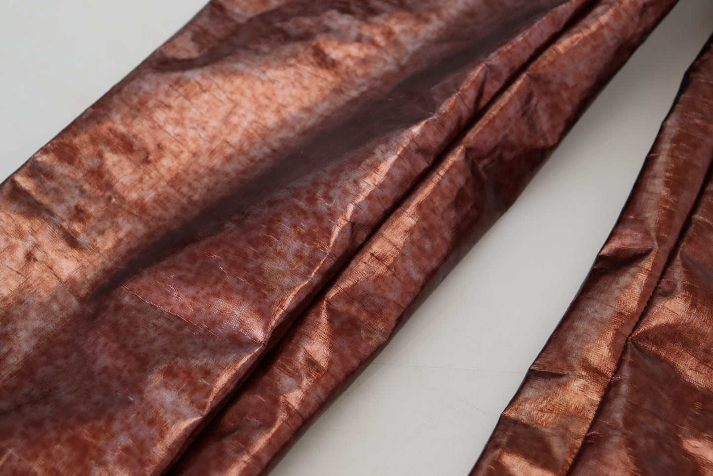 Dolce & Gabbana – Enge Jeans mit hoher Taille in Metallic-Bronze