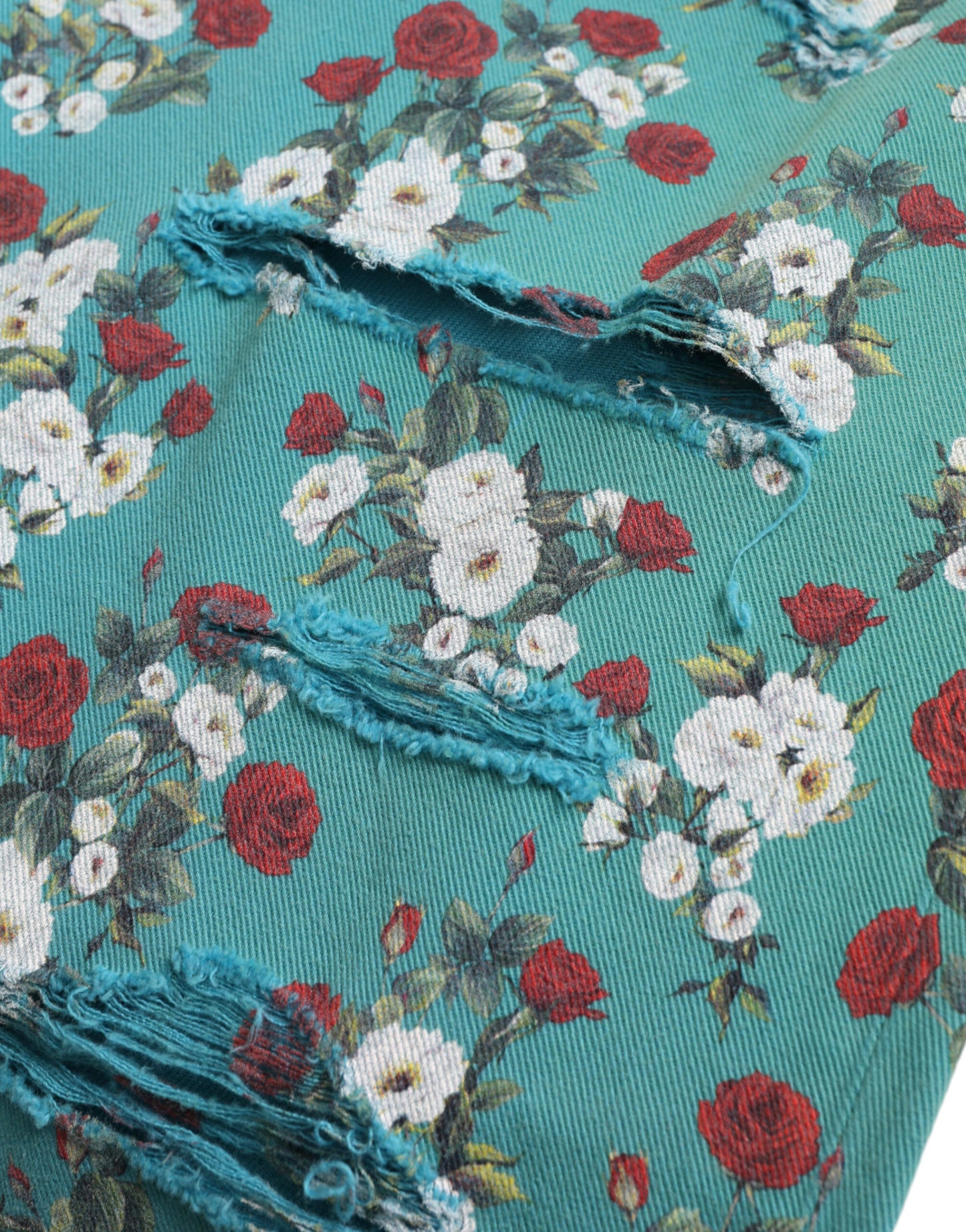 Dolce & Gabbana – Enge Jeanshose aus Baumwolle mit Blumenmuster in Blau