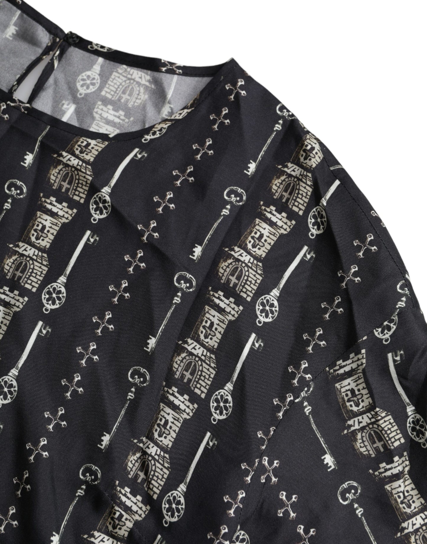 Dolce & Gabbana – Schwarzes Seidenblusen-T-Shirt mit Schloss-Print