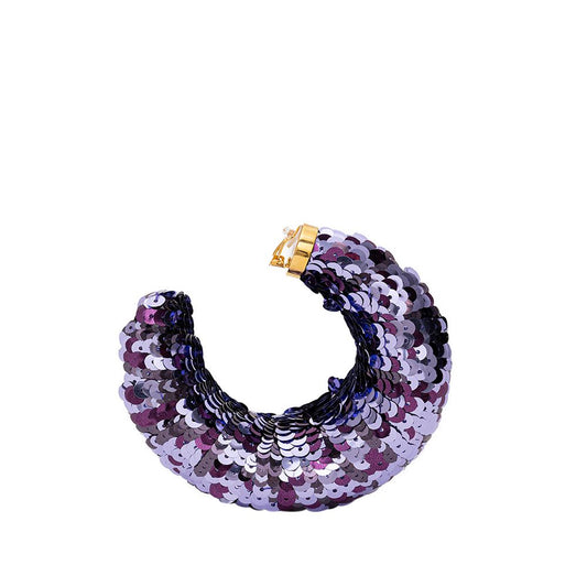 ملابس توم فورد المصنوعة من مادة البولي فينيل كلوريد الأرجوانية