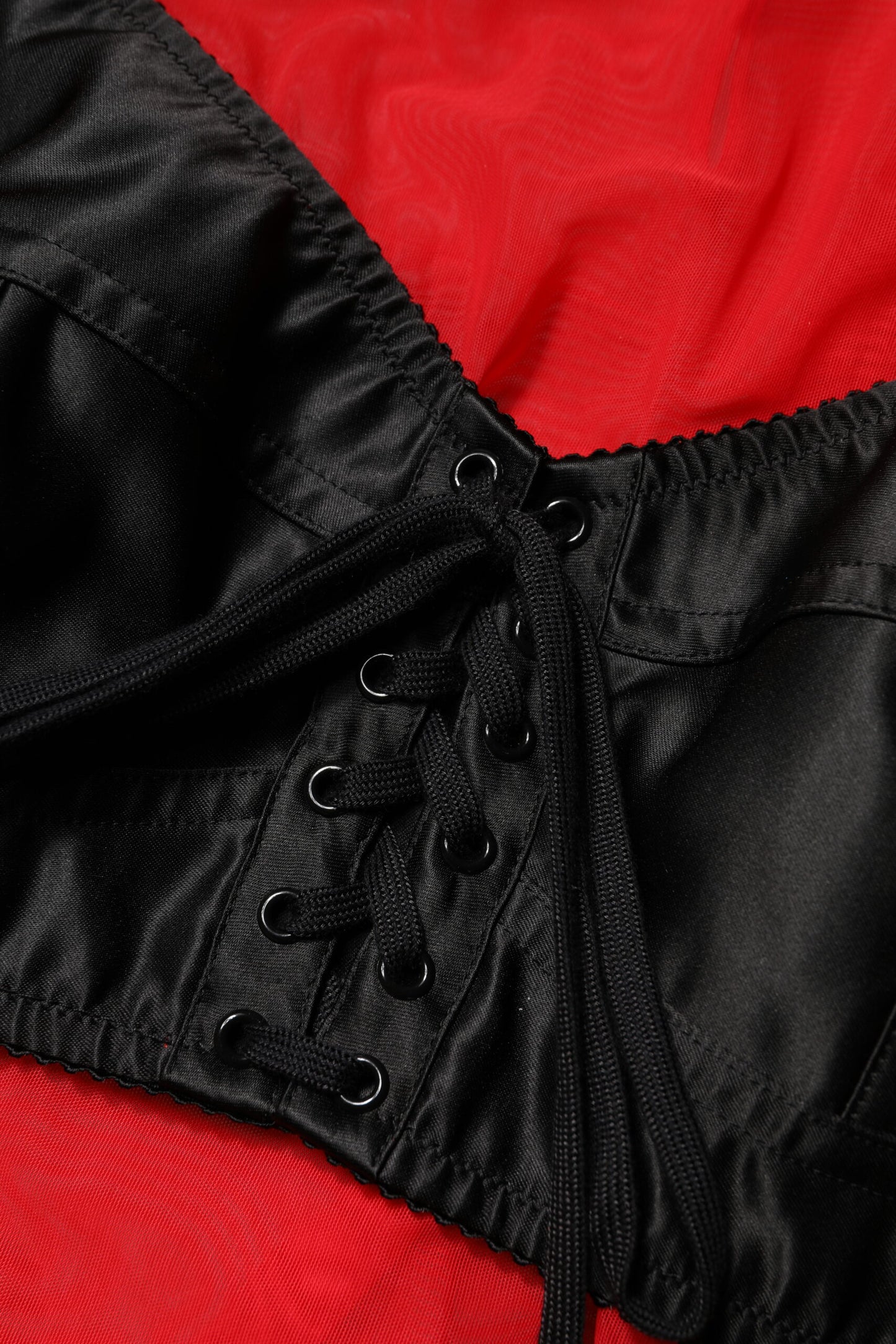Dolce & Gabbana – Rot-schwarzes Oberteil mit langen Ärmeln und Bustier-Detail
