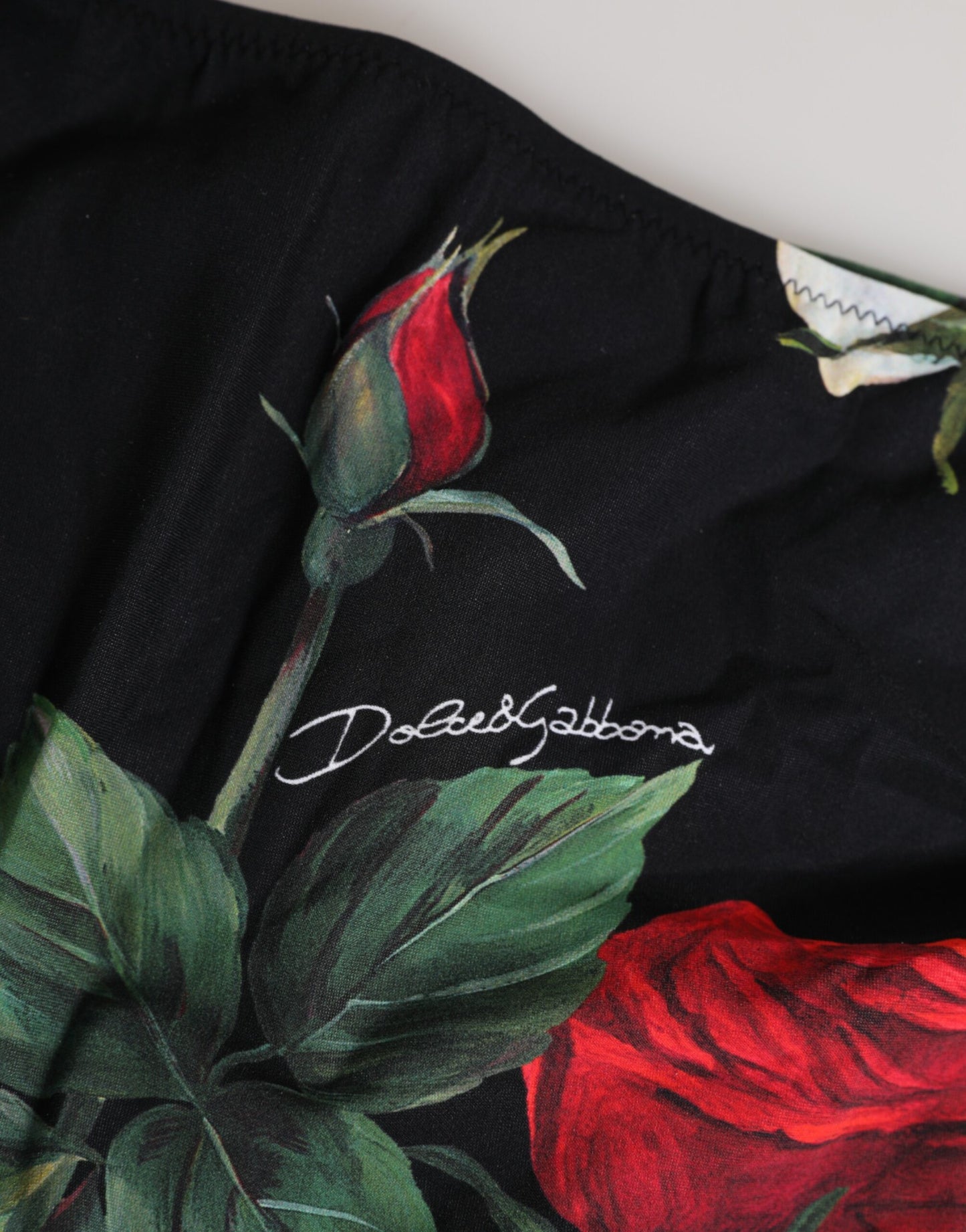 Dolce & Gabbana – Schwarze Bikinihose mit seitlicher Schnürung und Blumenmuster