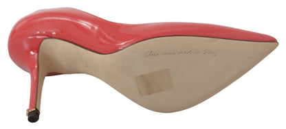 Dolce &amp; Gabbana Pumps aus dunkelrosa Lackleder