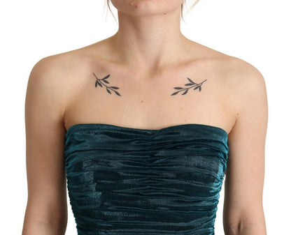 فستان دولتشي آند غابانا فيروزي اللون مع صدرية متوسطة الطول.