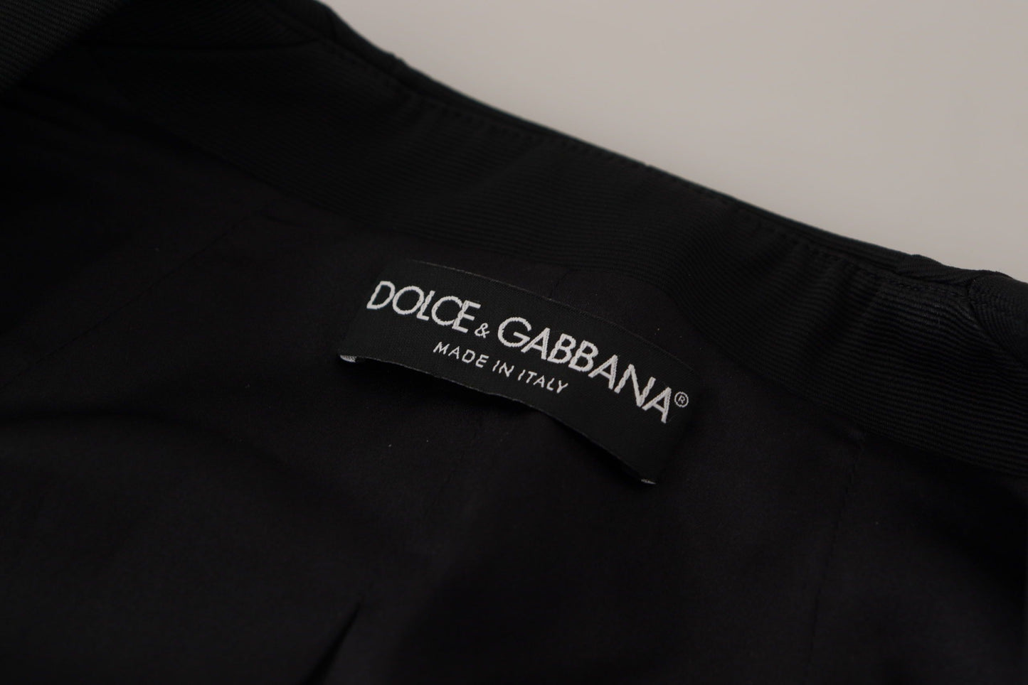Dolce &amp; Gabbana – Schwarze, schmal geschnittene Jacke mit langen Ärmeln und Druckknöpfen