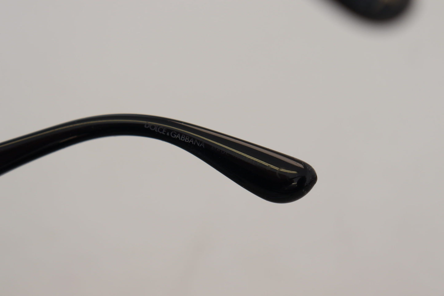 Dolce &amp; Gabbana – Polarisierte Sonnenbrille DG4326 mit Schmetterlingsmotiv und schwarzen Goldpailletten