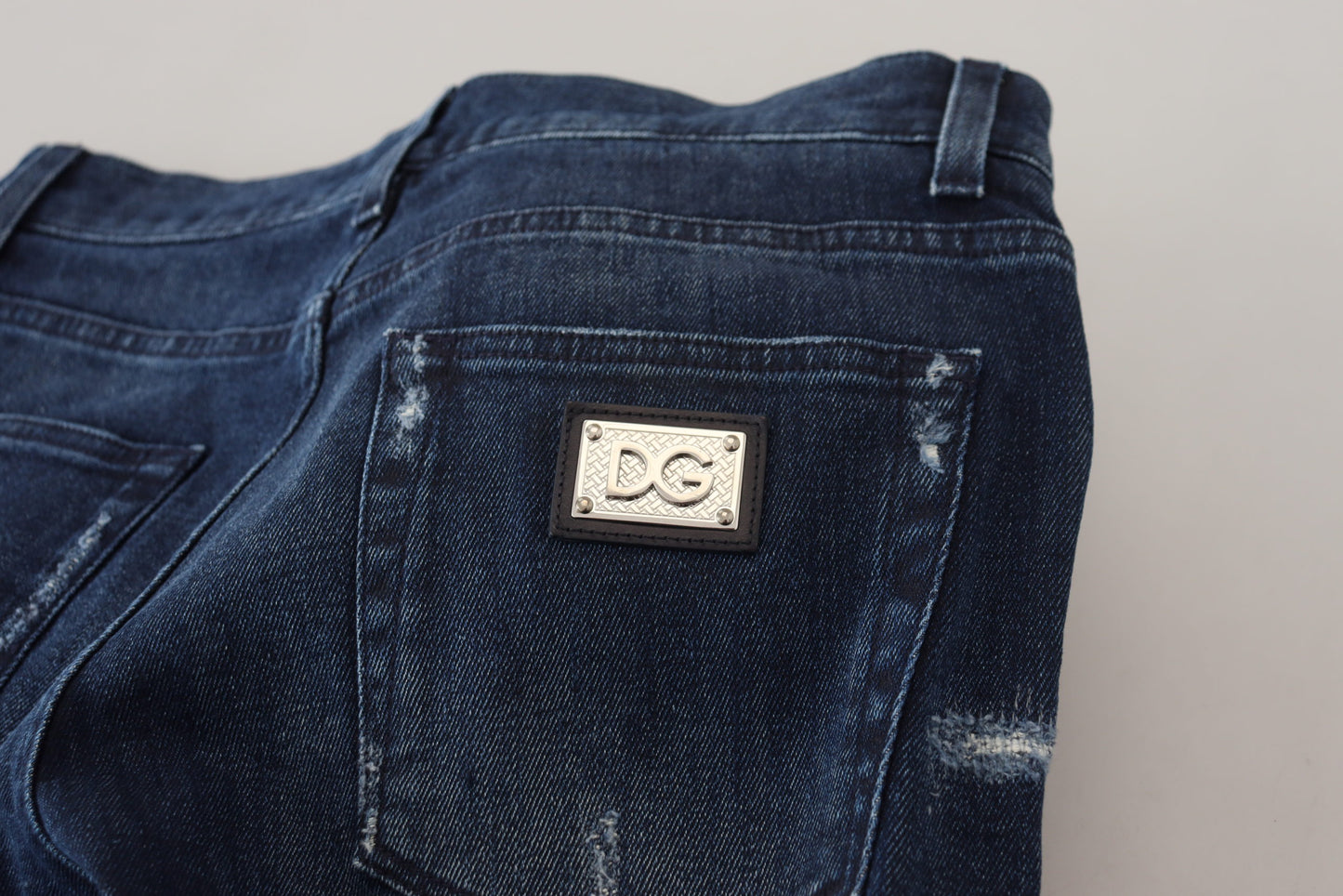 Dolce &amp; Gabbana – Skinny-Jeans aus zerfetztem Baumwoll-Denim in Blau