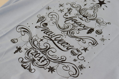 Dolce &amp; Gabbana Hellblaues Baumwoll-T-Shirt „Happy New Year 2017“