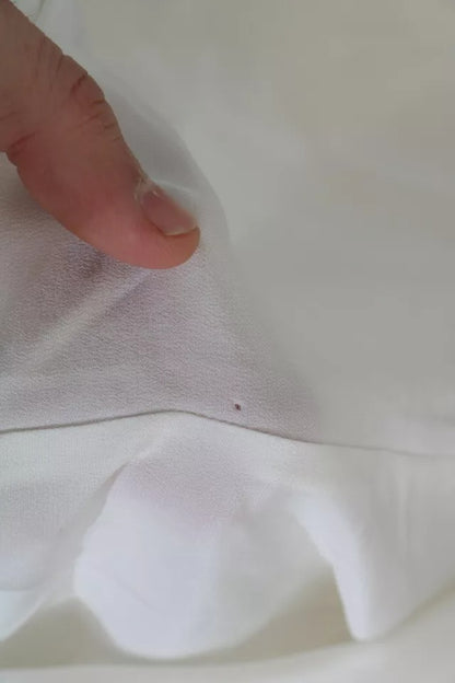 Dolce &amp; Gabbana – Seidentop mit Schalkragen und langen Ärmeln in Off-White