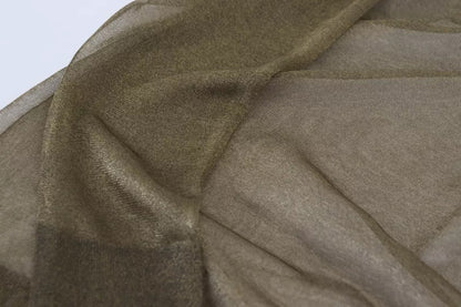 بلوزة دولتشي آند غابانا سوداء شفافة بياقة دائرية وأكمام طويلة