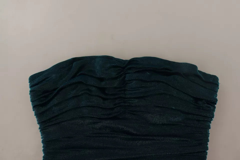 فستان دولتشي آند غابانا فيروزي اللون مع صدرية متوسطة الطول.