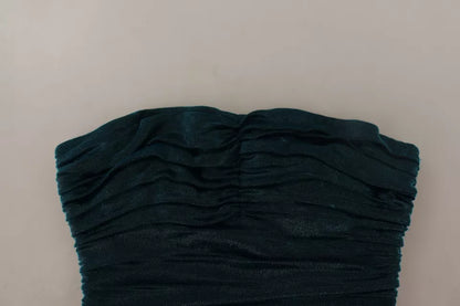 فستان دولتشي آند غابانا فيروزي اللون مع صدرية متوسطة الطول.