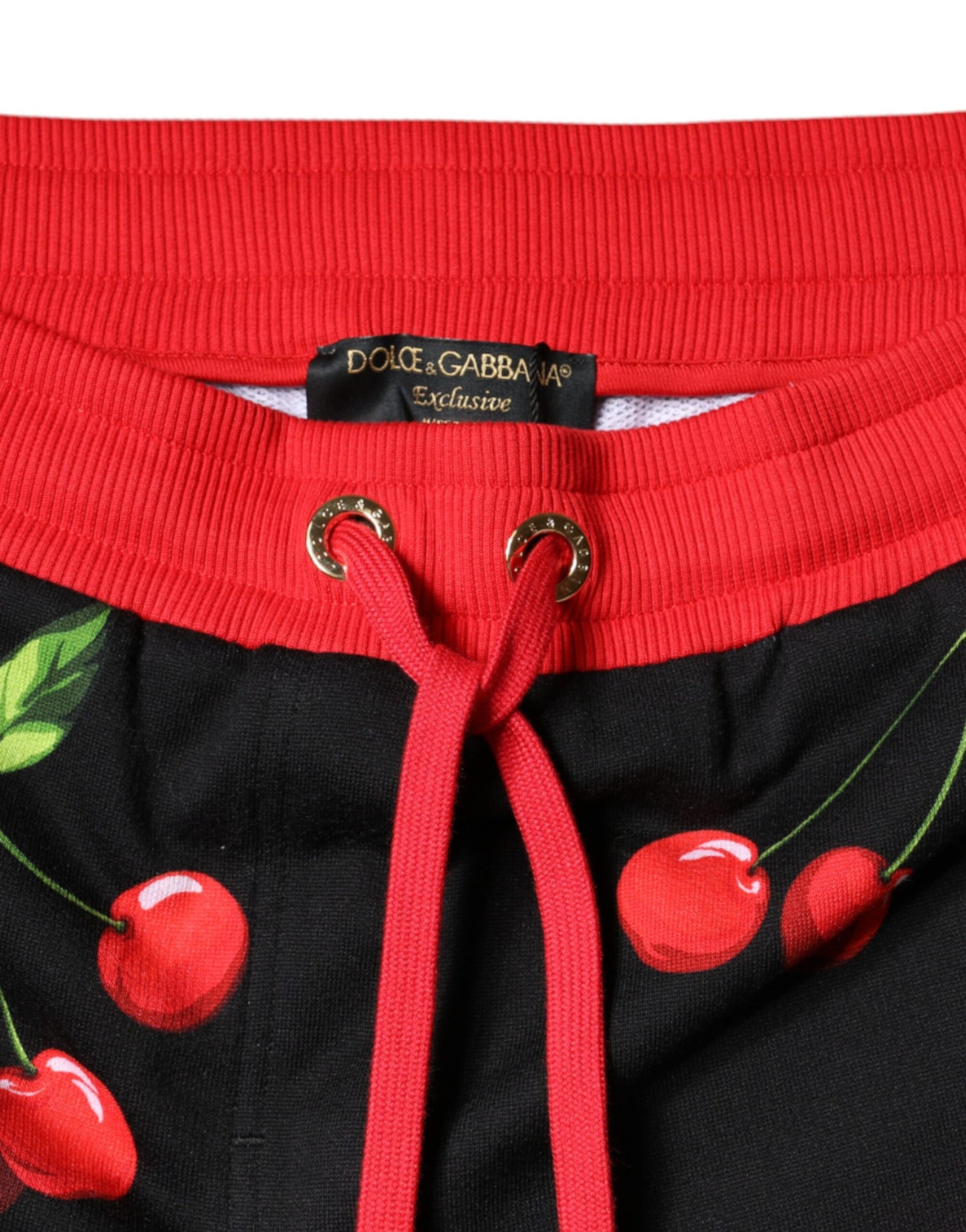 Dolce &amp; Gabbana – Jogginghose mit mittelhoher Taille in Schwarz und Rot mit Kirschen