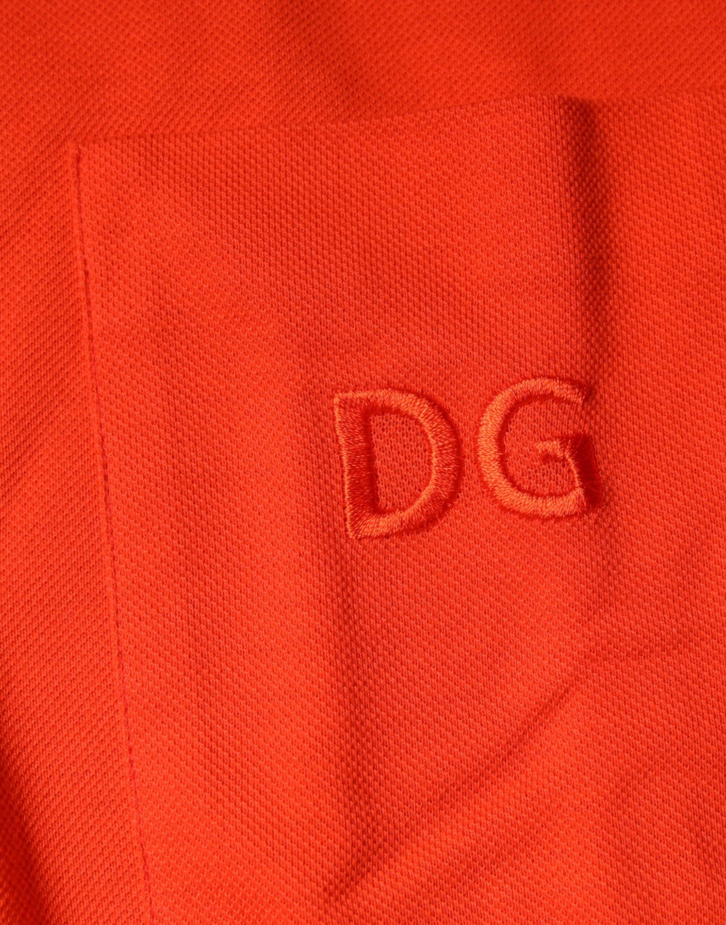 Dolce &amp; Gabbana – Orangefarbenes, lässiges Poloshirt aus Baumwolle mit Knopfleiste