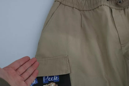 Dolce &amp; Gabbana Beige Cargohose mit Pin-Up-Print