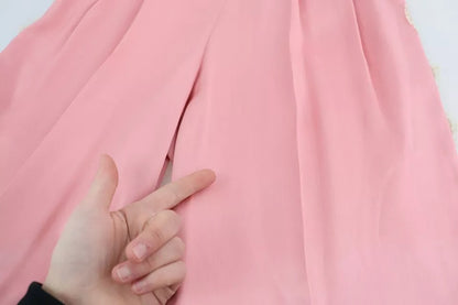 Dolce &amp; Gabbana – Hose aus Seidensatin mit weitem Bein und Spitzenbesatz in Rosa