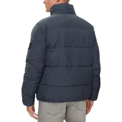 Calvin Klein Jeans – Blaue Polyamidjacken und -mäntel