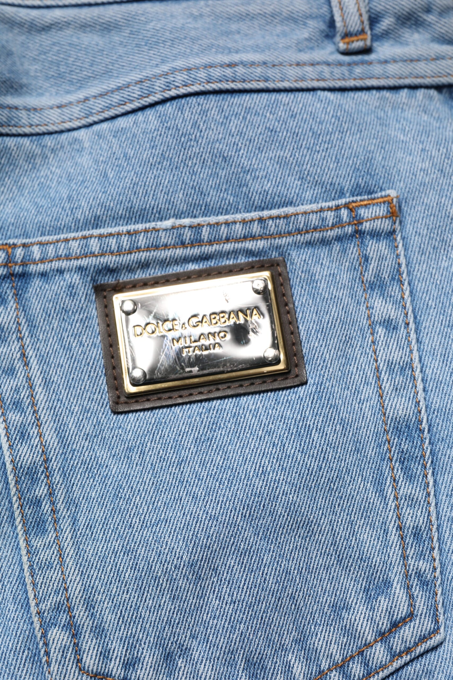 بنطلون جينز رجالي ضيق من القطن باللون الأزرق من دولتشي آند غابانا بخصر متوسط