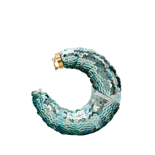 ملابس توم فورد الفيروزية المصنوعة من مادة البولي فينيل كلوريد