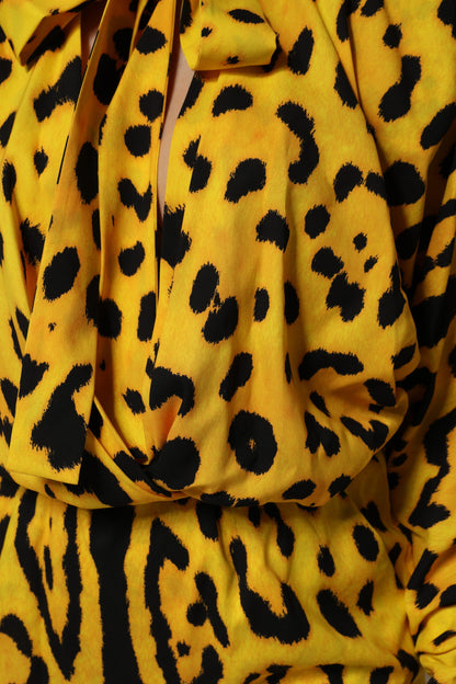 Dolce &amp; Gabbana – Gelbes Jumpsuit-Kleid mit langen Ärmeln und Leopardenmuster