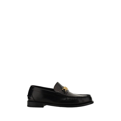 Versace Slipper aus schwarzem Kalbsleder Modell Bos Taurus zum Reinschlüpfen
