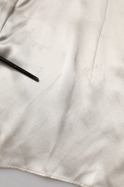 بلوزة دولتشي آند غابانا من الحرير الساتان باللون البيج بأكمام طويلة وياقة