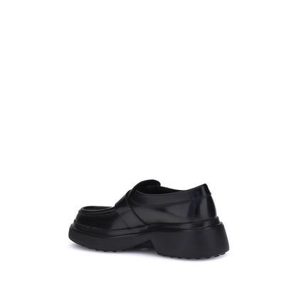 Schwarze Tod's Loafer mit Gummisohle und Plateau