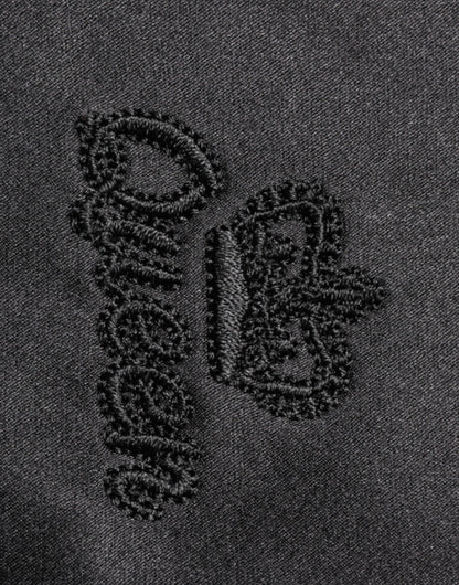 Dolce &amp; Gabbana – Blusenoberteil aus schwarzer Seide mit Ascot-Kragen und Knöpfen