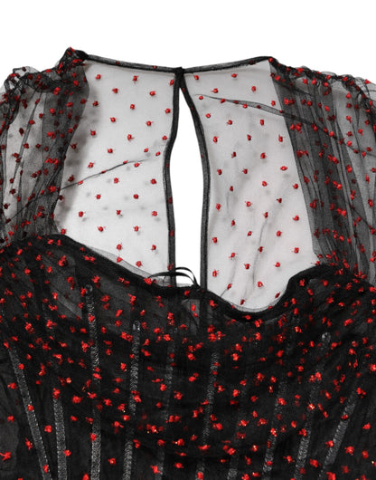 فستان دولتشي آند غابانا قصير بأكمام طويلة وحواف من الدانتيل الأسود