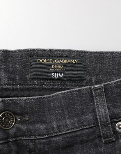 Dolce &amp; Gabbana – Slim Fit-Jeans aus schwarzer Baumwolle mit zerrissenem Logo