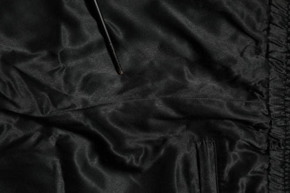 Dolce &amp; Gabbana – Jogginghose mit seitlichen Streifen und Krone aus Satin in Schwarz und Gold