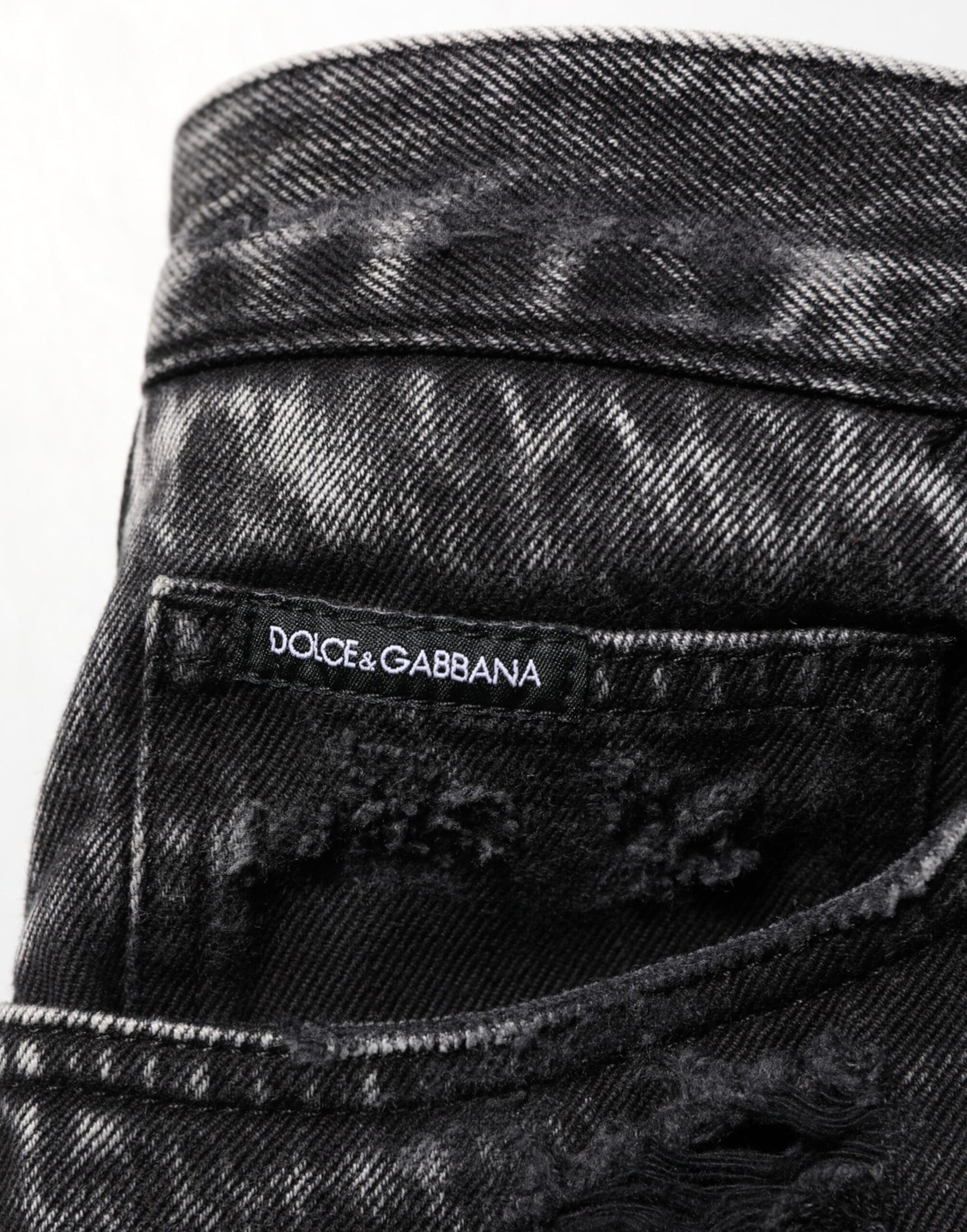 Dolce &amp; Gabbana – Lockere Jeans aus zerrissenem Baumwolldenim in Schwarz mit verwaschener Optik