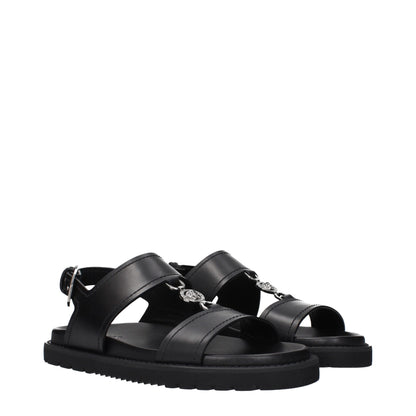 Versace – Flache Sandalen aus schwarzem Leder
