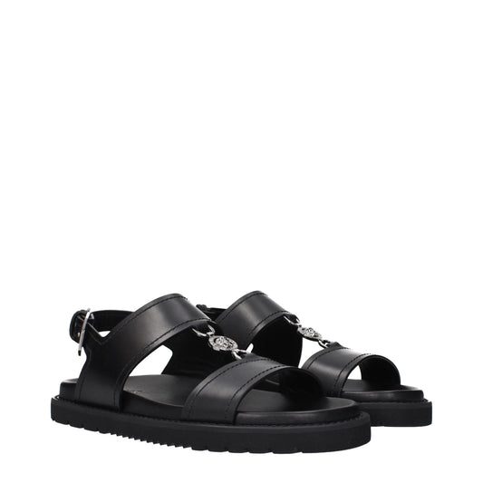 Versace – Flache Sandalen aus schwarzem Leder