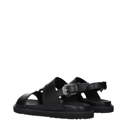 Versace – Flache Sandalen aus schwarzem Leder