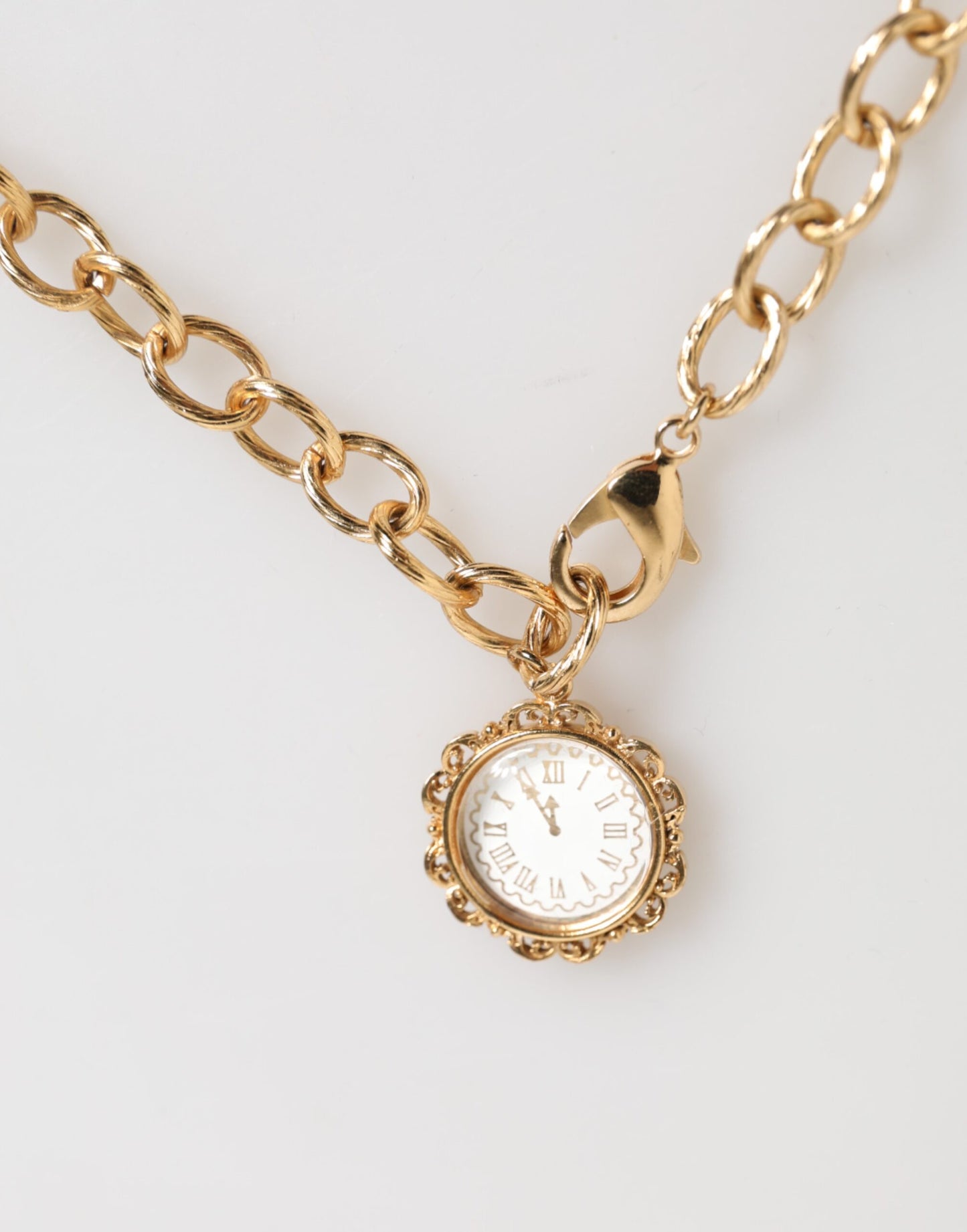 Dolce &amp; Gabbana Goldfarbene Halskette mit Kristall-Uhr-Anhänger