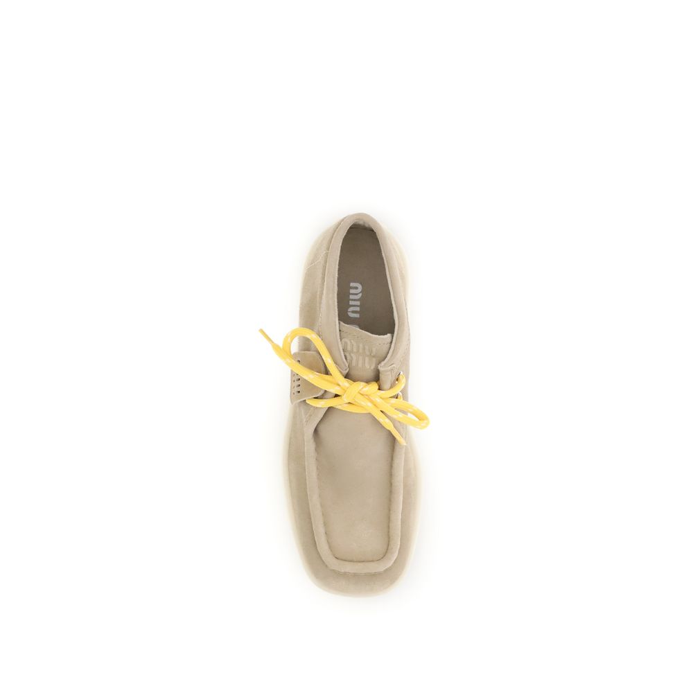 Miu Miu Plateau-Stiefeletten aus Leder